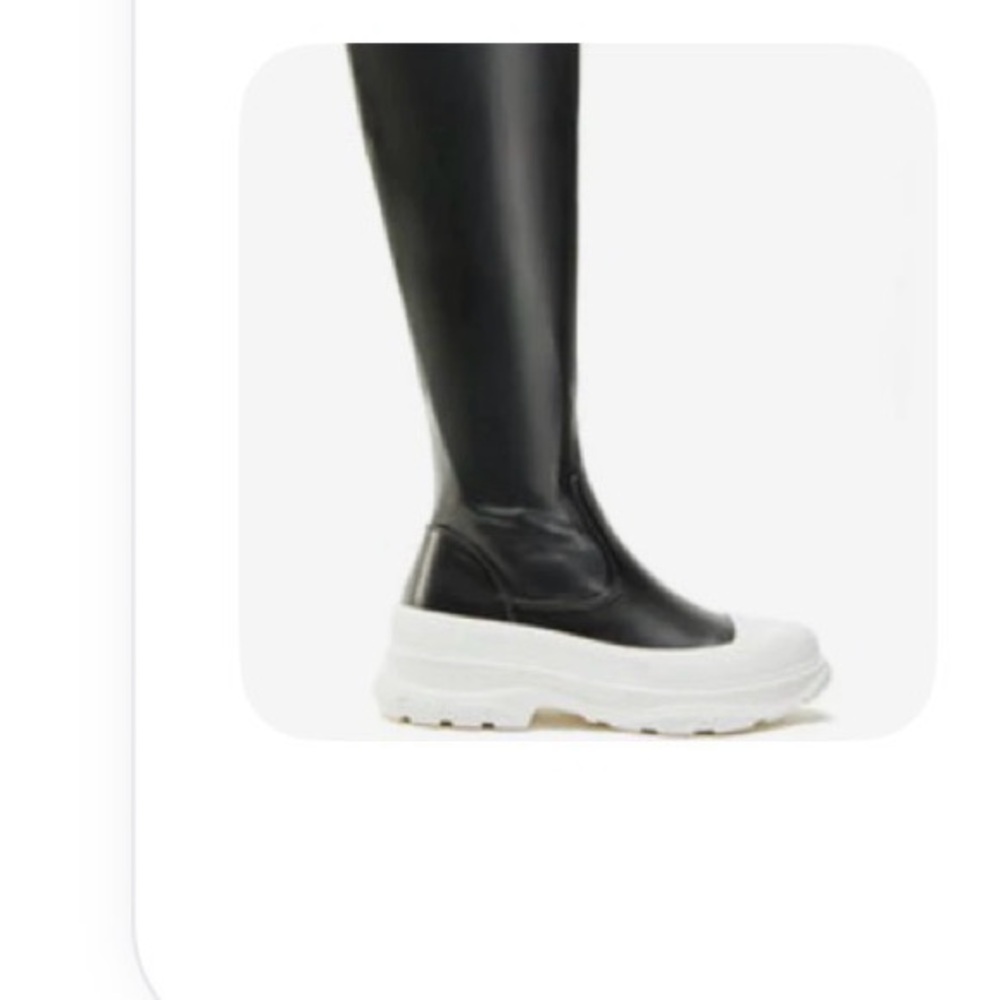 Sleek Black Women's Boots with White Sole